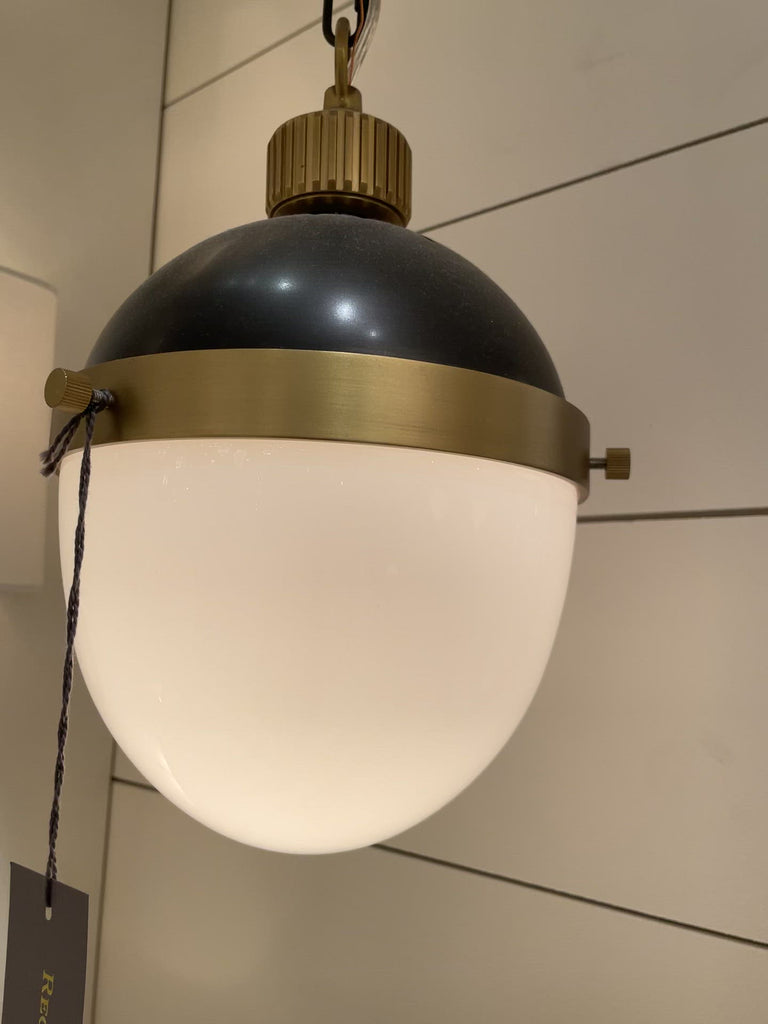 The Otis Pendant features a bold collaboration of metal and frosted glass—suspended by an extendable pipe and chain for a versatile integration into any aesthetic. This is classy, elegant piece to add to your kitchen, dining room, or other area needing extra light.   Size: 8.5"w x 8.5"d x 33.5"h