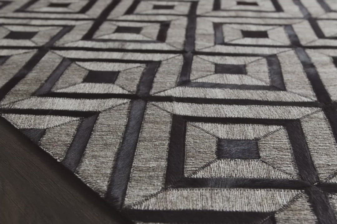 The Dorado Collection from India features an intriguing combination of hand stitched authentic cowhide and hand woven viscose for a look that's at once bold and unexpected. Available in four sizes including a runner.  Hand-Stiched Front: Textile Part: 62% Rayon | 34% Wool | 4% Other Fibers Non-Textile Part: Leather DB-02