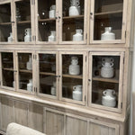 This Haley Cabinet has ample storage, with glass door panels opening to shelves and a bottom sliding door that opens to more shelves. Made from reclaimed pine with a white wash grey sealed finish, this brings an antique feel to any room.  Reclaimed Pine  White Wash Grey Sealed Finish  Flat Glass Door Panels