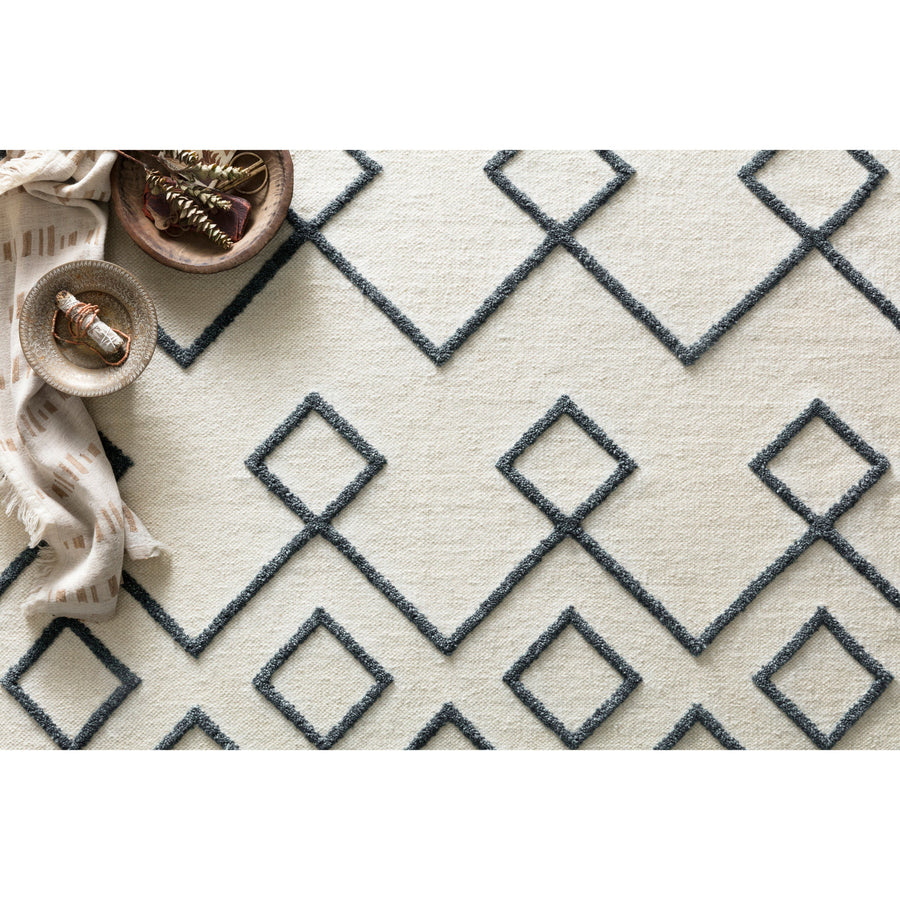 The Adler Collection pushes traditional flat-weaves to new heights. Its innovative high/low texture elevates the wool to form a pronounced pattern and faintly Moroccan style look. Hand-woven of 100% wool, Adler is available in a cool, on-trend set of neutral colors.  Hand-Woven 100% Wool AW-04 Ivory