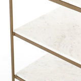 Add a pop of sophistication to any space. Classic white marble lays three tiers of smooth shelving for plenty of space. A hammered grey iron frame and casters place a feminine, high-contrast spin on bedside storage.  Dimensions: 25"w x 18"d x 26"h Materials: Iron, Marble Colors: Antique Brass & Polished White Marble