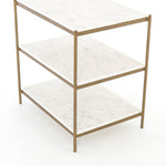 Add a pop of sophistication to any space. Classic white marble lays three tiers of smooth shelving for plenty of space. A hammered grey iron frame and casters place a feminine, high-contrast spin on bedside storage.  Dimensions: 25"w x 18"d x 26"h Materials: Iron, Marble Colors: Antique Brass & Polished White Marble