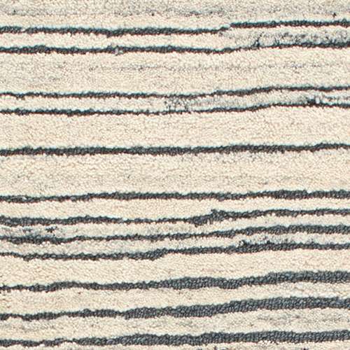 Inspired by substrate layers of sandstone sediments that chronicle the millennia, this luxurious, irregularly striped wool rug will stand the test of time. The subtle degradations of a natural undyed fleece pile enhance the finely observed irregular striping in a softly mineral palette. The subtle beauty of the higher sheared tufts emphasizes the contrast of the densely looped stripes. Amethyst Home provides interior design, new construction, custom furniture, and area rugs in the Austin metro area.