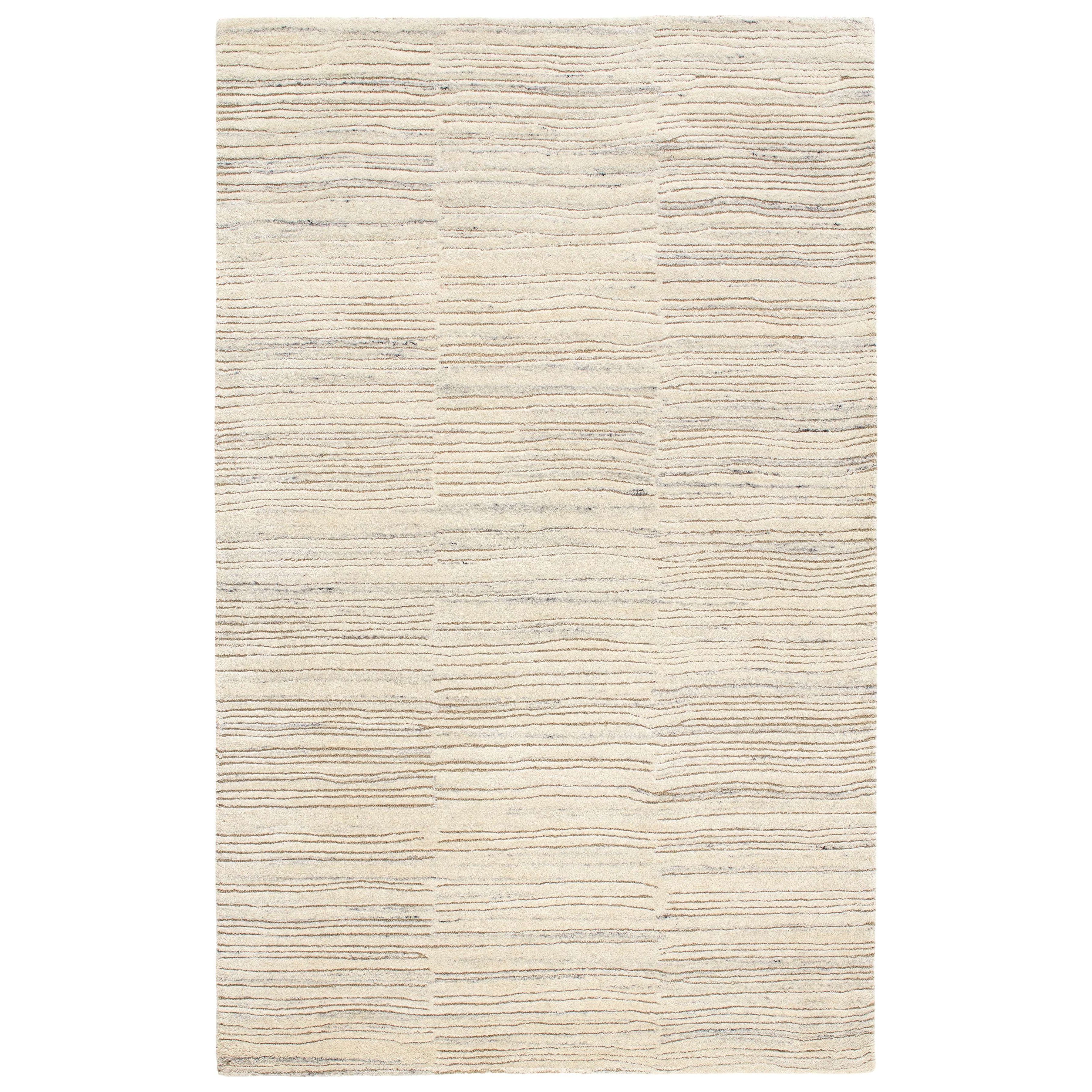 Inspired by substrate layers of sandstone sediments that chronicle the millennia, this luxurious, irregularly striped wool rug will stand the test of time. The subtle degradations of a natural undyed fleece pile enhance the finely observed irregular striping in a softly mineral palette. The subtle beauty of the higher sheared tufts emphasizes the contrast of the densely looped stripes. Amethyst Home provides interior design, new construction, custom furniture, and area rugs in the Newport Beach metro area.