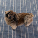 Part of our Bunny Williams collection, this delicately striped, navy indoor/outdoor rug was inspired by an antique rug sample from the designer's own personal collection. Due to the handmade nature of this area rug, variations in color are expected. Dhurrie rugs are woven to be lightweight, low profile and reversible. Amethyst Home provides interior design, new construction, custom furniture, and area rugs in the Omaha metro area.