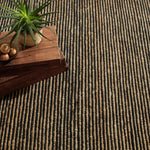 Combining a low profile surface with a dramatic nubby texture, this hardworking and durable rug features undyed Natural jute stripes combined with the warmth and comfort of Black wool. From our Bunny Williams collection. Amethyst Home provides interior design, new construction, custom furniture, and area rugs in the Austin metro area.