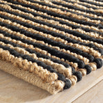 Combining a low profile surface with a dramatic nubby texture, this hardworking and durable rug features undyed Natural jute stripes combined with the warmth and comfort of Black wool. From our Bunny Williams collection. Amethyst Home provides interior design, new construction, custom furniture, and area rugs in the Dallas metro area.