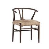 Dramatic and bold! This Baden Dining Chair is perfect for adding fun style to your space.  Has a wishbone styled frame and the fur seat is soft, plush and eye-catching.  Oak wood frame, drifted matte brown Goat hide seat Size: 22"l x 23"d x 31"h