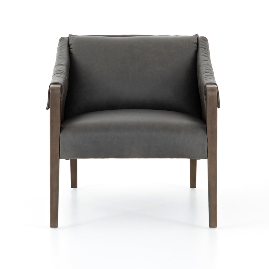 The Bauer Ebony Leather Chair is a favorite lush seating of ebony top-grain leather that fastens to grey birch framing via trend-forward buckles. The angular arms honor mid-century design, adding a throwback feel to a cutting-edge look.  Size: 27.00"w x 35.00"d x 29.00"h 
