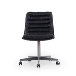 Featuring Malibu Desk Chair - Rider Black by Four Hands at Amethyst Home. Paired back and fashion-forward, this minimalist Malibu Desk Chair in black top-grain leather offers maximum comfort. Inspired by workspaces of the ‘50s and ‘60s. Stainless steel casters make for stylish ease in the workplace. Height not adjustable.
Overall Dimensions: 20.75"W x 26.25"L.  Amethyst Home provides interior design, new home construction design consulting, vintage area rugs, and lighting in the Boston metro area.
