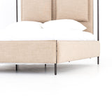 Safari styling gets a modern reboot with this Leigh Upholstered Bed. Linen-blend upholstery of neutral taupe lays a texture-rich base for a forward-thinking bedroom look. Brown leather straps secure decorative headboard pillows, suspended for eye-catching effect. Box spring required.