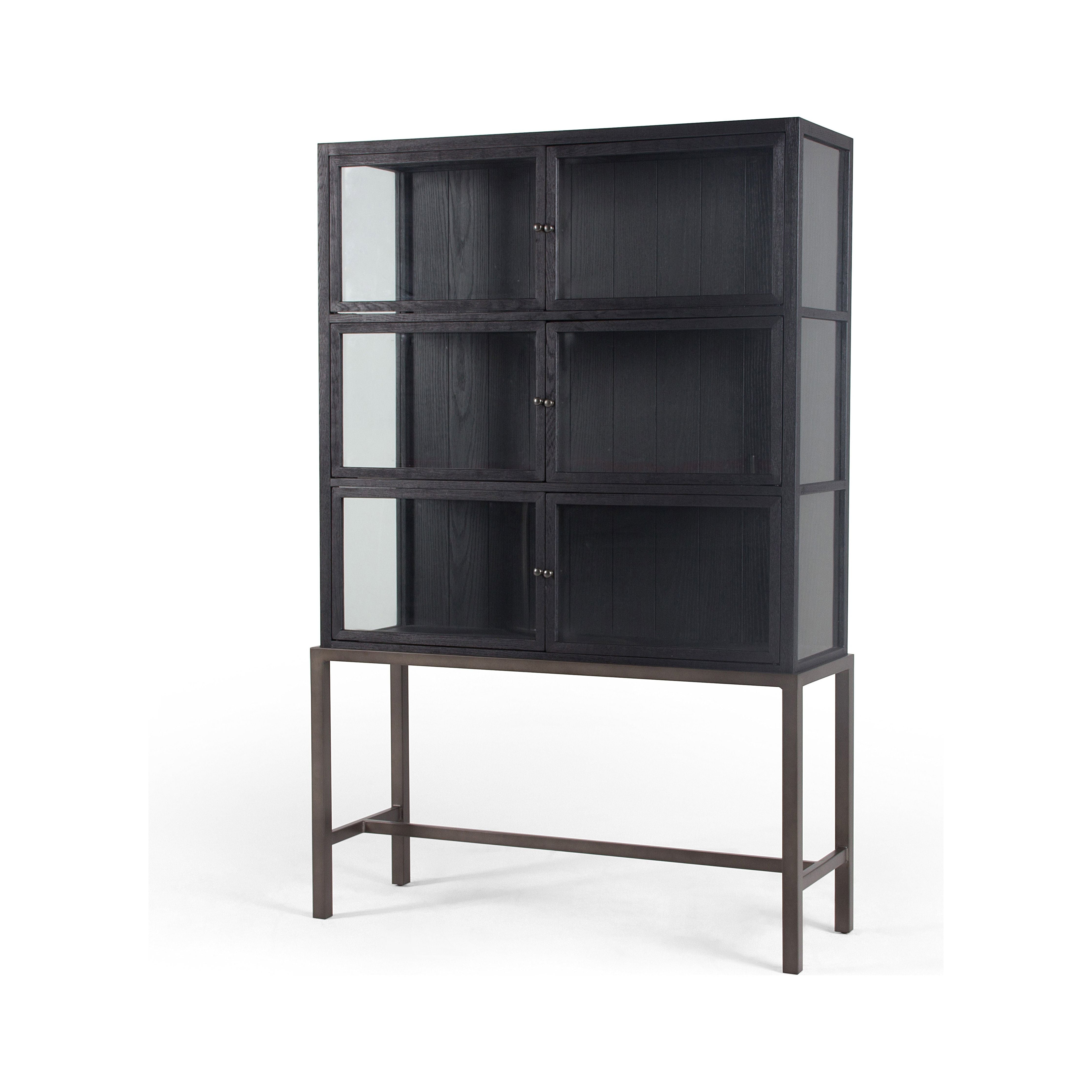 We love how the Spencer Drifted Black Curio Cabinet is perched on a simple, waxed black iron pedestal. The rustic black-finished oak forms an airy curio cabinet designed to showcase life’s artifacts.  Overall Dimensions: 45.75"w x 16"d x 69"h Materials: Plywood & Oak Veneer, Iron, Glass, Oak