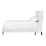 Elevate your sleep situation with this Francesca Upholstered Bed by Cisco Home. With a tall back and exposed wood legs, this will complete the look for any bedroom!
