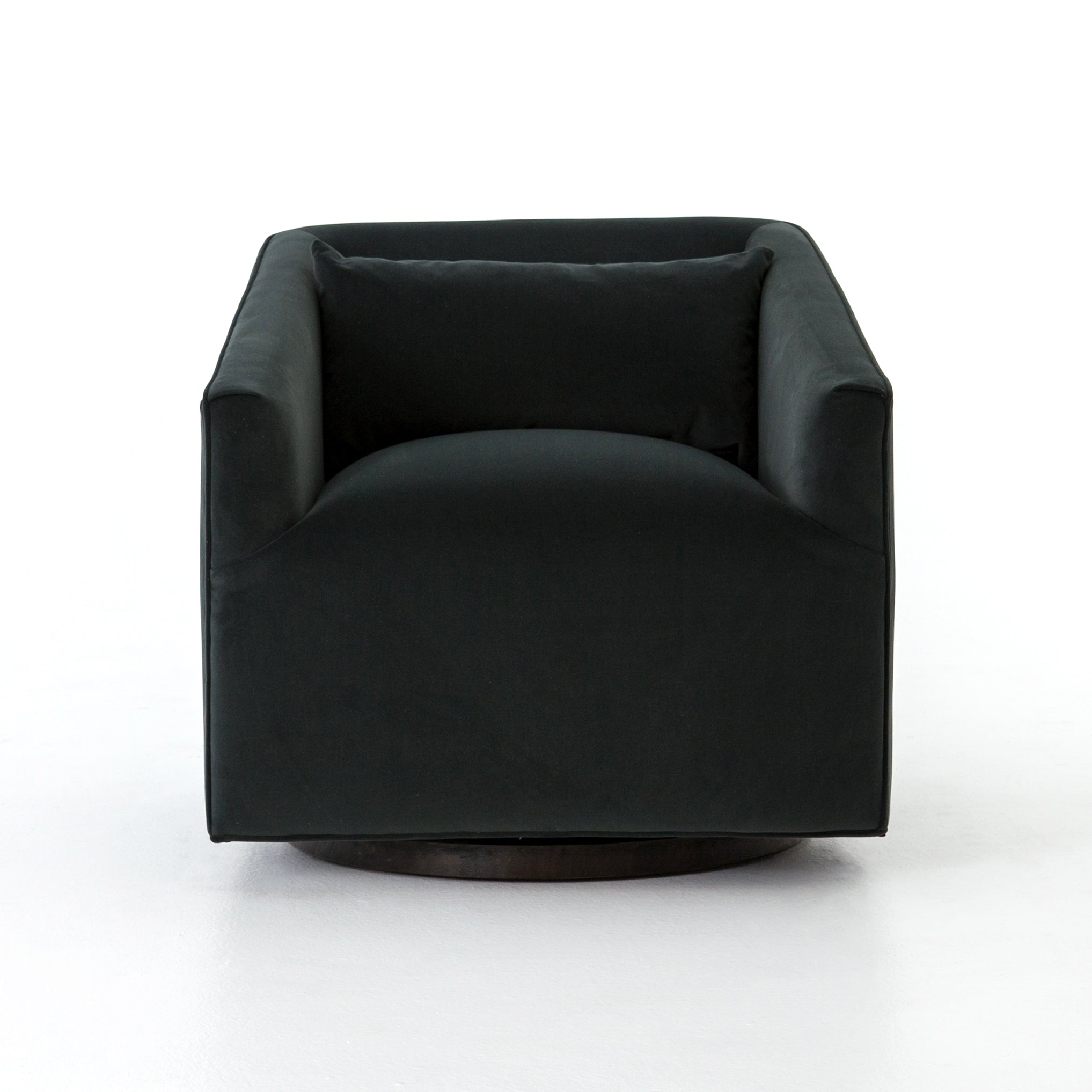 The York Swivel Chair is small in scale, but substantial in comfort. The chair's precisely-tailored seating in a modern smoky velvet offers a touch of light swivel movement. The base of the chair has a moss-tinged charcoal hue adding a fashion-forward twist.