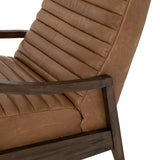 The Chance Recliner has an invitingly curved seat with dramatic horizontal channels is covered in soft, camel-colored top-grain leather. Rich, tonal frame captures alluring negative—and positive—spaces. A push recliner takes this forward-thinking lounger to the next level.  Overall Dimensions: 27.50"w x 56.00"d x 36.00"h Seat Depth: 20.25" Seat Height: 18" Arm Height from Floor: 24" Arm Height from Seat: 6"