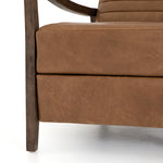 The Chance Recliner has an invitingly curved seat with dramatic horizontal channels is covered in soft, camel-colored top-grain leather. Rich, tonal frame captures alluring negative—and positive—spaces. A push recliner takes this forward-thinking lounger to the next level.  Overall Dimensions: 27.50"w x 56.00"d x 36.00"h Seat Depth: 20.25" Seat Height: 18" Arm Height from Floor: 24" Arm Height from Seat: 6"