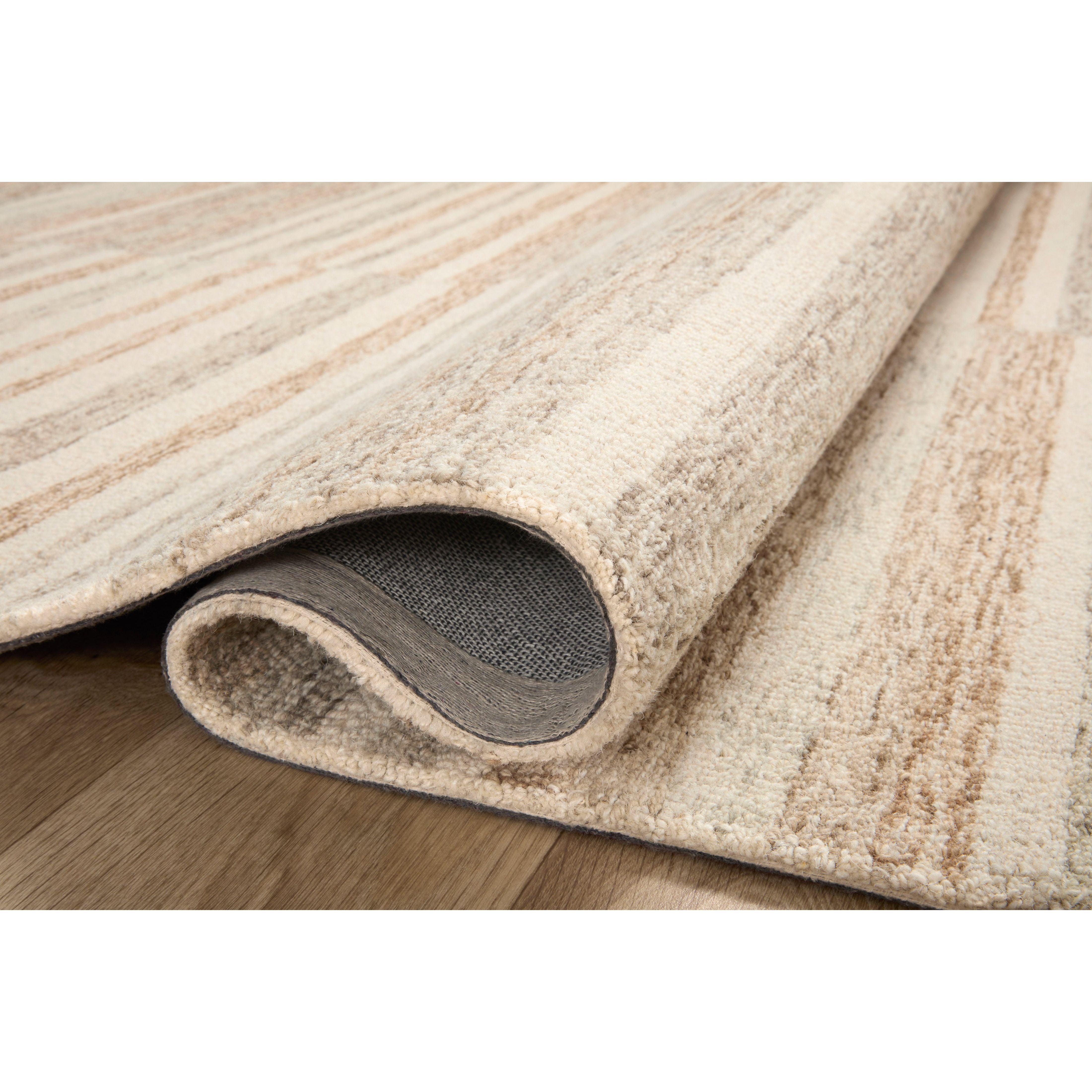The subtle, warm tonal patterns remind us of our favorite California cool hemp rugs. Known for its durability, the Chris Ivory / Clay hooked wool rug is a smart choice for any room in your home that gets lots of love. Amethyst Home provides interior design services, furniture, rugs, and lighting in the Dallas metro area.