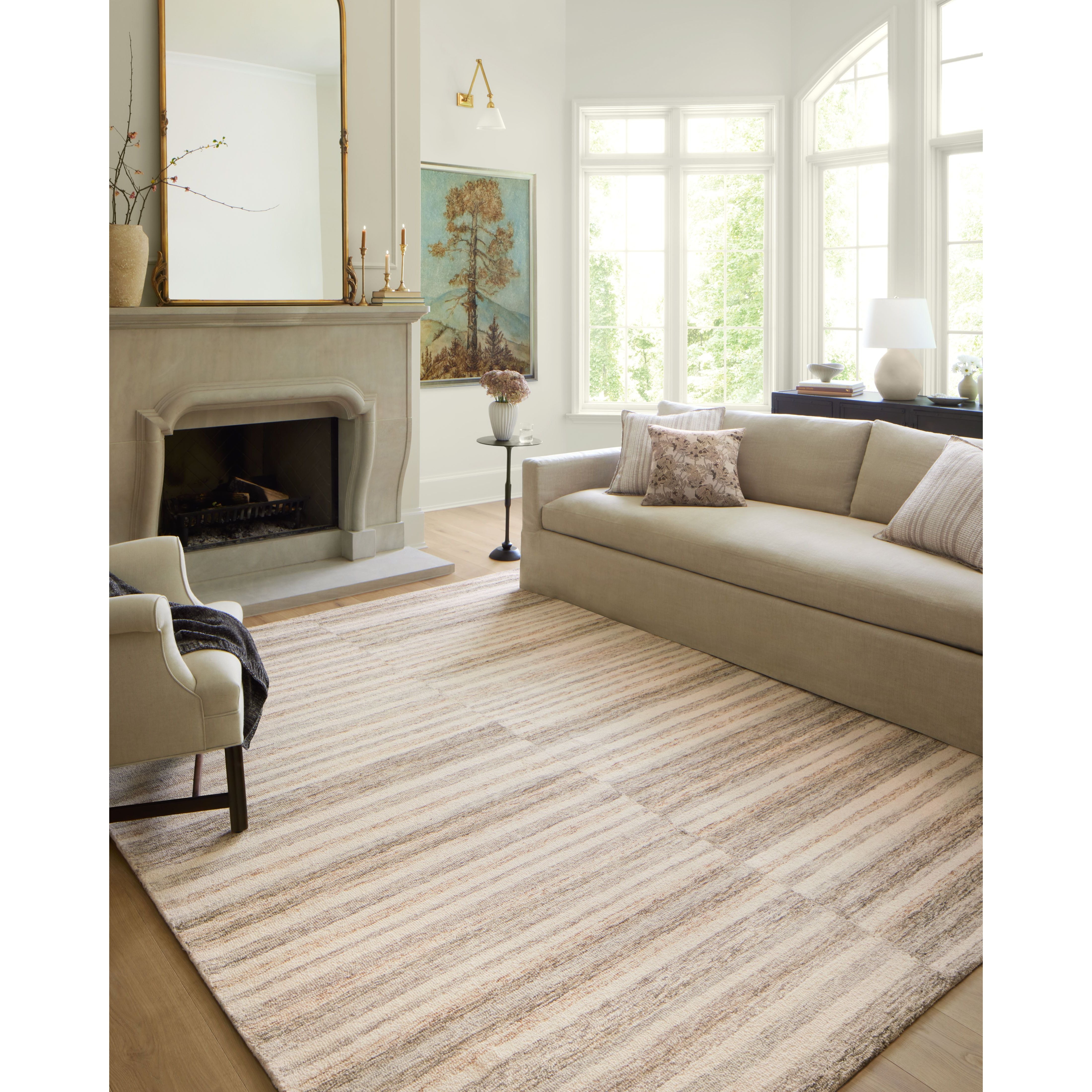 The subtle, warm tonal patterns remind us of our favorite California cool hemp rugs. Known for its durability, the Chris Ivory / Clay hooked wool rug is a smart choice for any room in your home that gets lots of love. Amethyst Home provides interior design services, furniture, rugs, and lighting in the Omaha metro area.