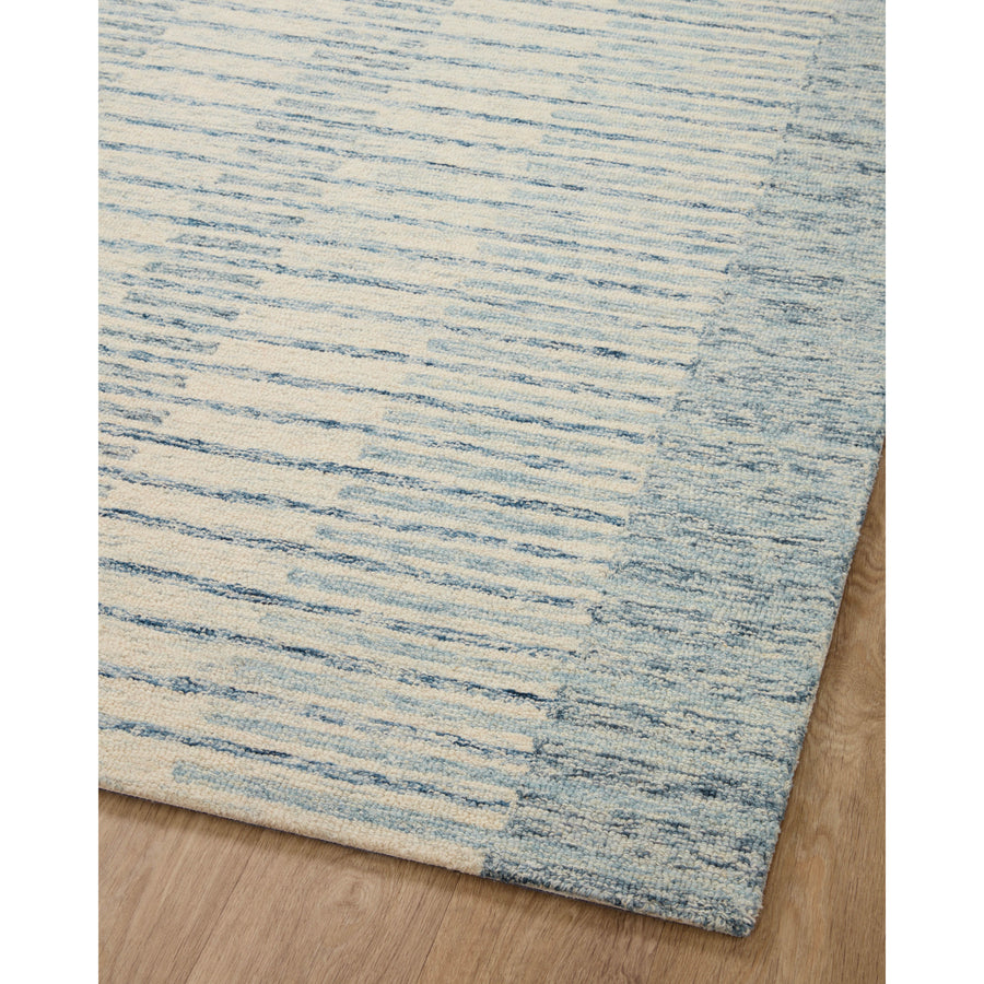 Blues skies ahead. We love this Chris Ivory / Denim rug for a coastal vibe where the only cares in the world are a day on the water. Amethyst Home provides interior design services, furniture, rugs, and lighting in the Austin metro area.