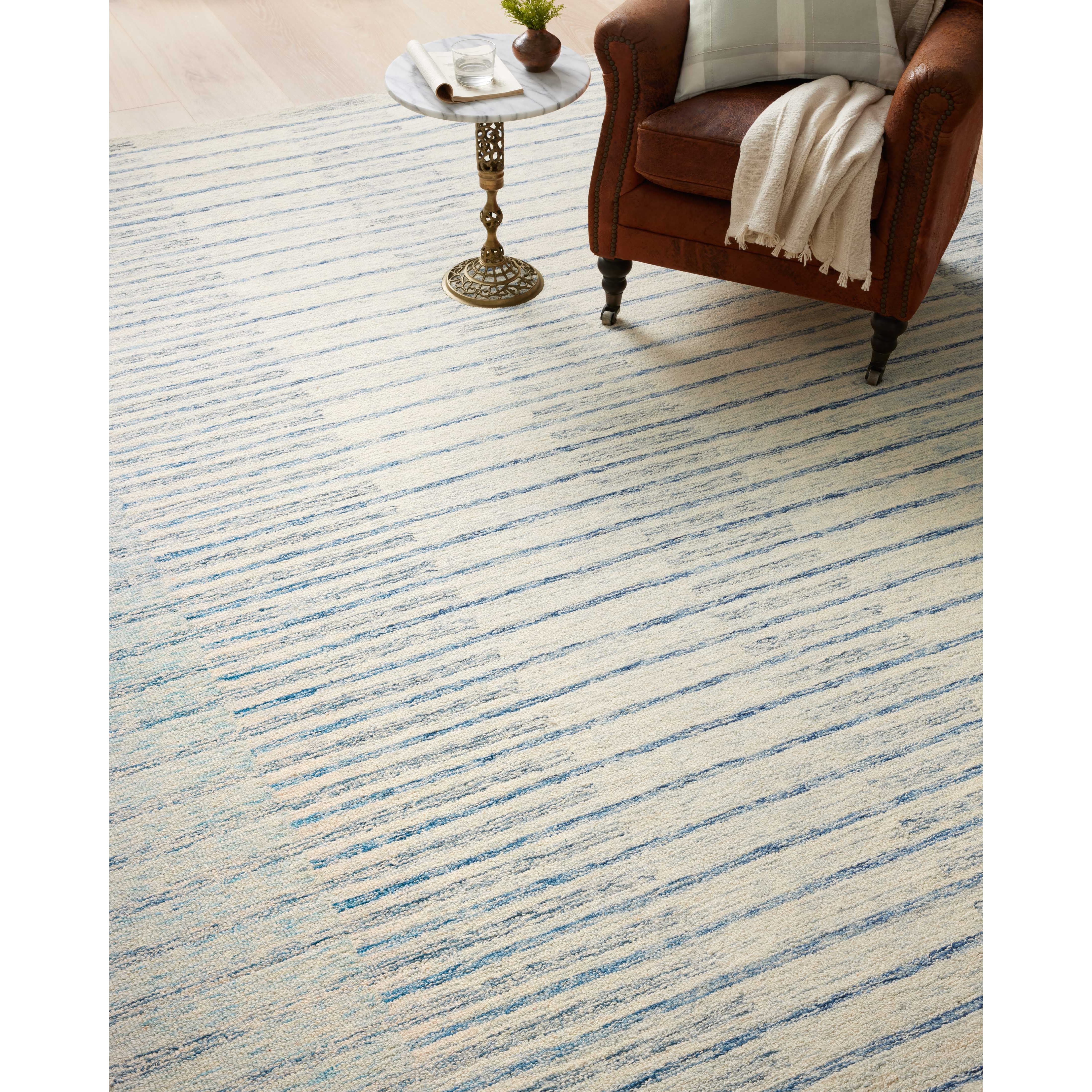 Blues skies ahead. We love this Chris Ivory / Denim rug for a coastal vibe where the only cares in the world are a day on the water. Amethyst Home provides interior design services, furniture, rugs, and lighting in the Seattle metro area.