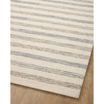 Known for its durability, the Chris Ivory / Slate hooked wool rug is a smart choice for any room in your home that gets lots of love. The subtle, tonal stripes remind us of our favorite California cool hemp rugs. Amethyst Home provides interior design services, furniture, rugs, and lighting in the Austin metro area.