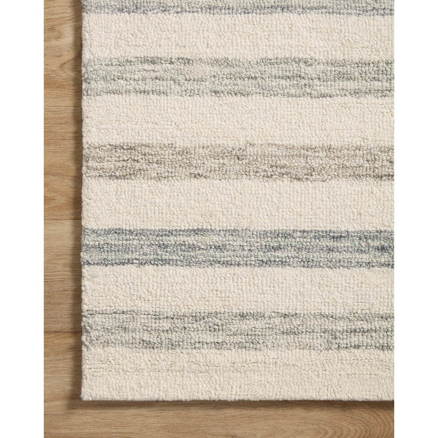 Known for its durability, the Chris Ivory / Slate hooked wool rug is a smart choice for any room in your home that gets lots of love. The subtle, tonal stripes remind us of our favorite California cool hemp rugs. Amethyst Home provides interior design services, furniture, rugs, and lighting in the Calabasas metro area.