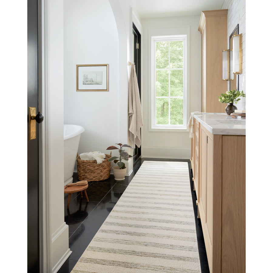 Known for its durability, the Chris Ivory / Slate hooked wool rug is a smart choice for any room in your home that gets lots of love. The subtle, tonal stripes remind us of our favorite California cool hemp rugs. Amethyst Home provides interior design services, furniture, rugs, and lighting in the Des Moines metro area.