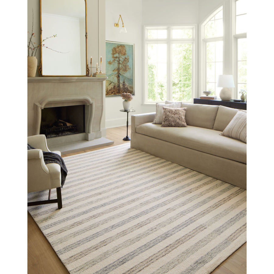 Known for its durability, the Chris Ivory / Slate hooked wool rug is a smart choice for any room in your home that gets lots of love. The subtle, tonal stripes remind us of our favorite California cool hemp rugs. Amethyst Home provides interior design services, furniture, rugs, and lighting in the Omaha metro area.