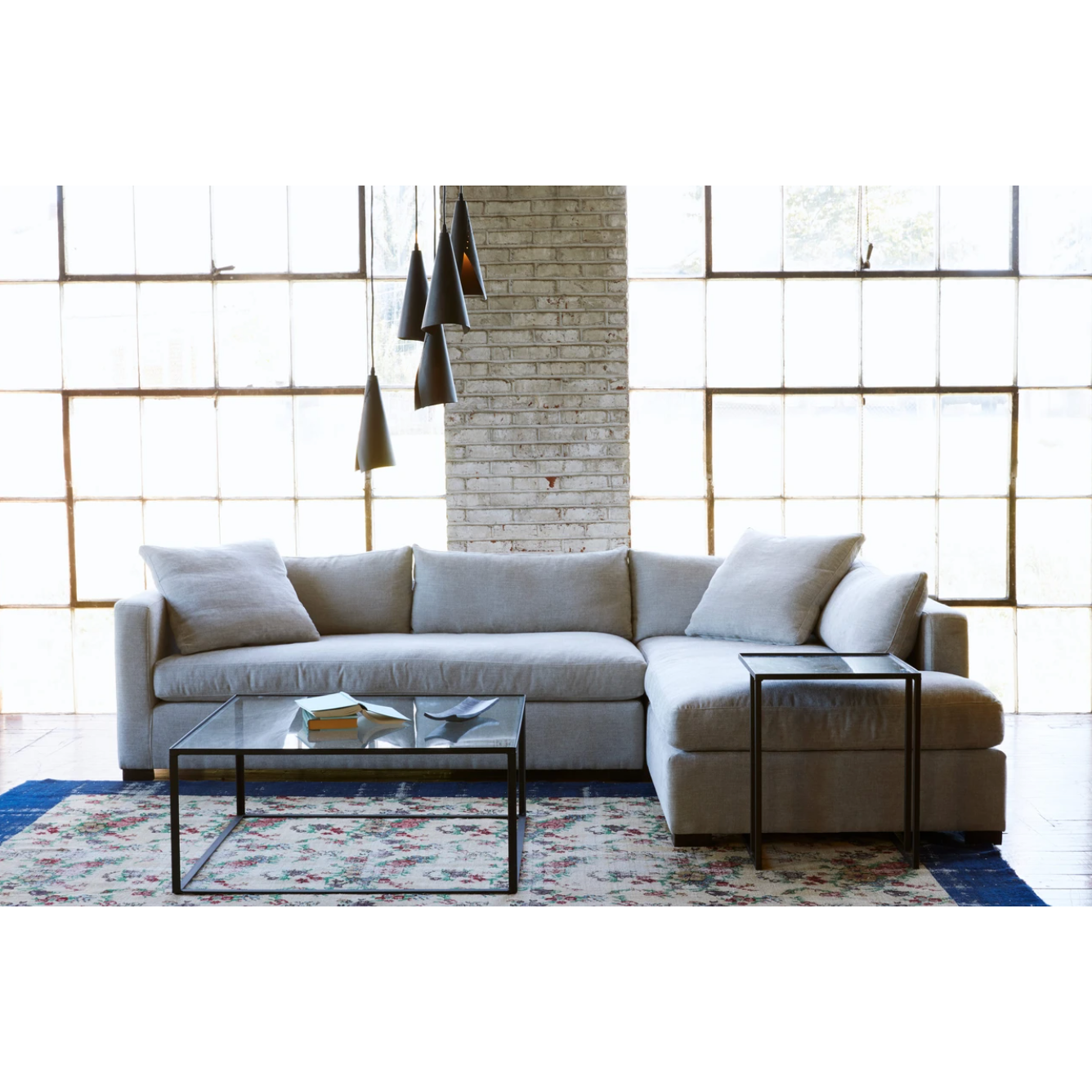 The Agosto 2 pc Sectional by Cisco Brothers offers a modern, clean look. Entertaining guests or making memories with the family, this sectional will stay in the family for years to come. Photographed in Clayton Flax. 