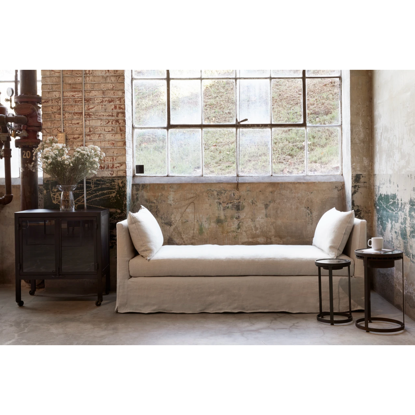 The April Daybed by Cisco Brothers is one of our favorite, most versatile pieces for any room in your home. Photographed in Brevard Birch and Otis White. 