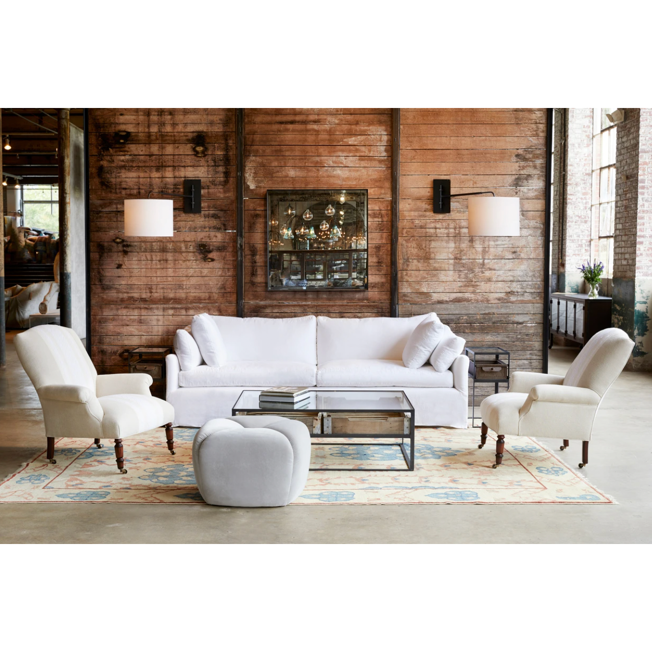 The Lanister Sofa by Cisco Brothers refreshes your space with a hint of modern style on a classic silhouette. A sophisticated design with butterfly stitching on the back cushions and down construction with cloud-like softness. The Lanister Sofa showcases a traditional yet sleek look, with a lasting allure that makes it an instant classic. Photographed in Otis White. 