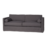 Refresh your space with a touch of transitional style with this Vista Slipcovered 84" Sofa - Essentials by Cisco Brothers. The Vista showcases an angular, modern silhouette with flat welt detailing. This sofa has a soft fill two-over-two seat and feather cloud back cushion fill. The structured design is softened by lumbar pillows.      Overall: 84"w x 36"d x 28"h