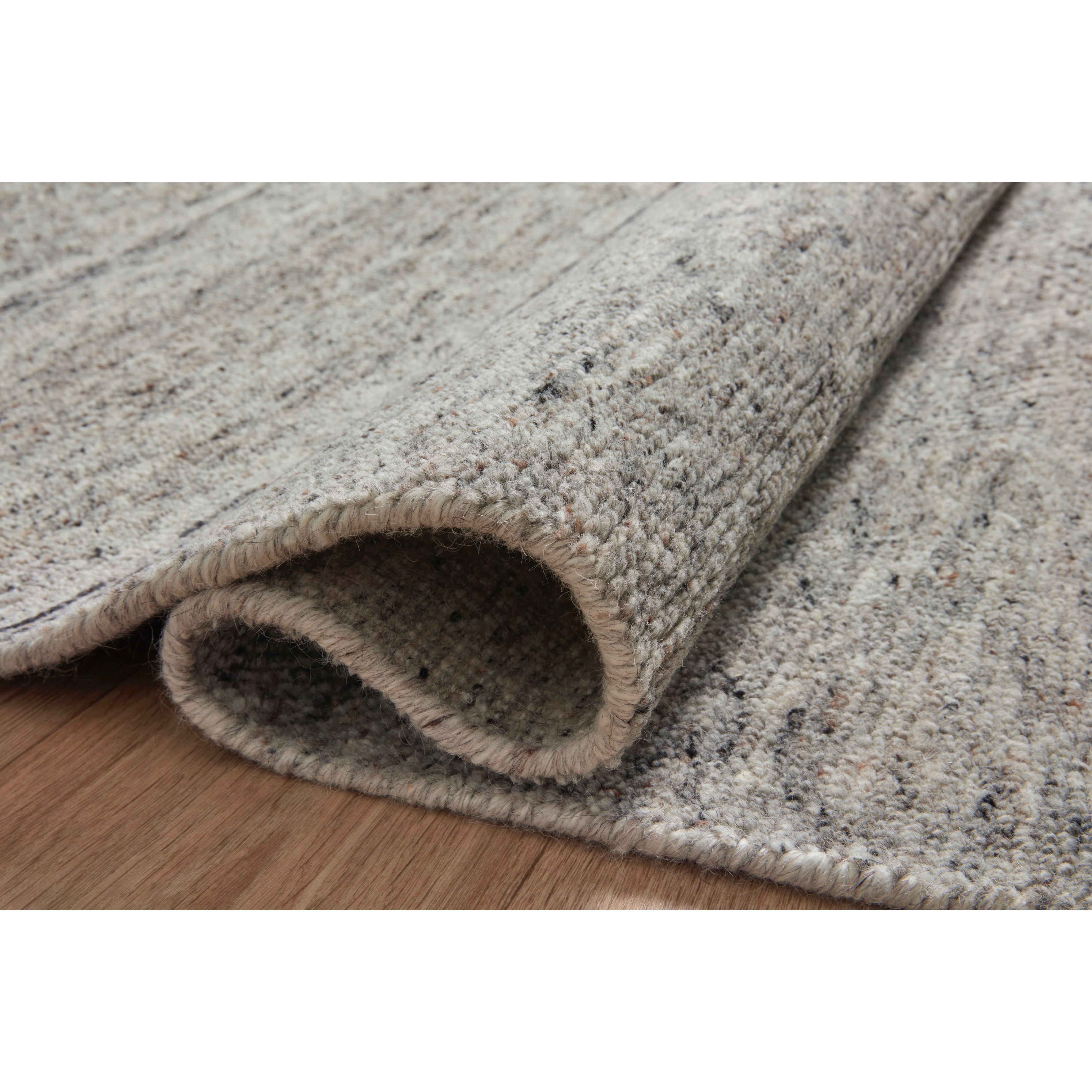 Featuring Collins Amber Lewis x Loloi Pebble / Silver Hand-Knotted Rug by Loloi at Amethyst Home. The Collins Pebble / Silver rug for Amber Lewis x Loloi is hand-knotted of wool and cotton by skilled artisans in India. Collins features varying knotting techniques interwoven to create a uniquely texture pattern, elevating any space with this versatile neutral. C. Amethyst Home provides interior design, new construction, custom furniture, and rugs for the Winter Park and Orlando, Florida metro area.