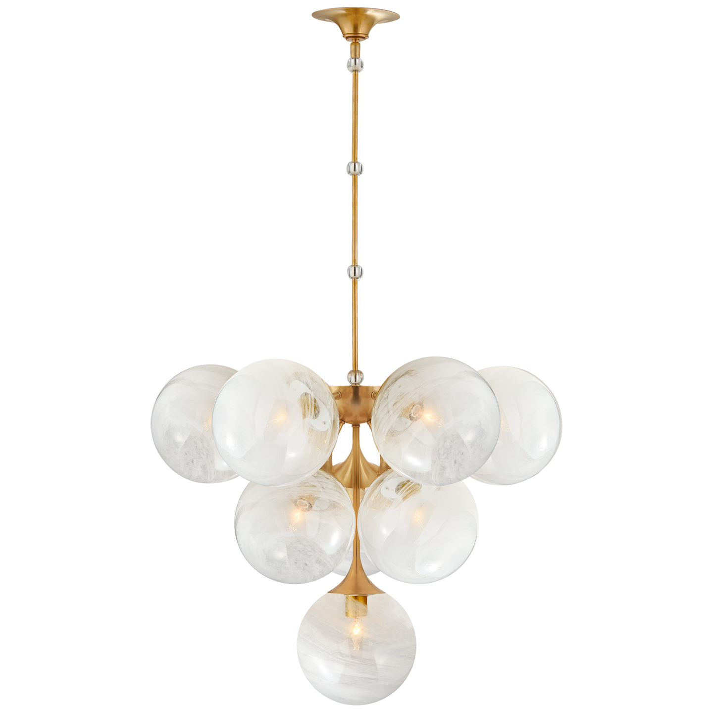 We love the white strie glass globes on this Cristol Medium Chandelier by Visual Comfort. It brings a stunning and unique look to any living room, dining room, or kitchen  Designer: AERIN