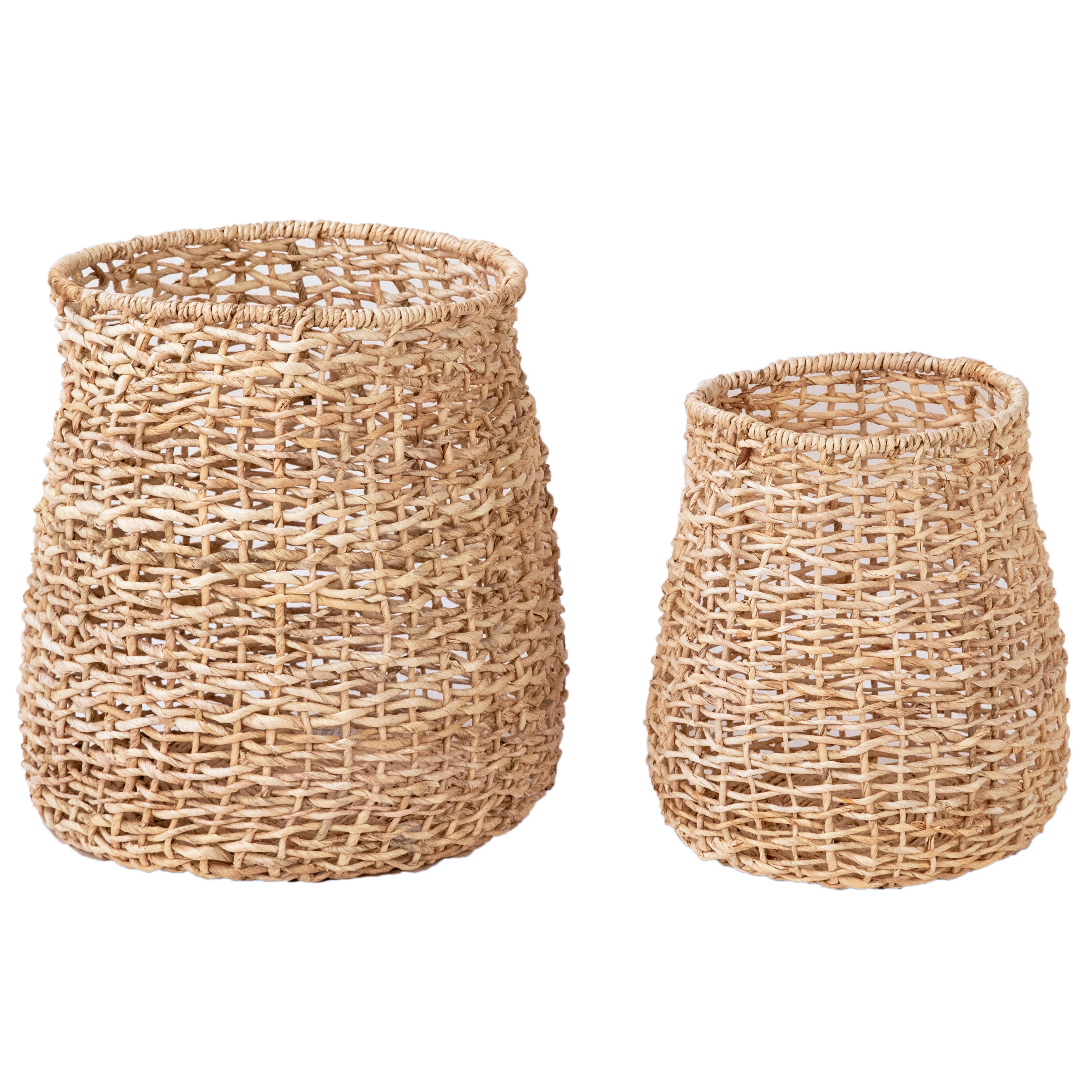 Create a warm and relaxed look in your home with this set of decorative baskets. These baskets are crafted from natural, hand-braided Abaca fibers, a durable material known for its exceptional strength and flexibility. With their organic and subtle expression, these baskets will make a stunning addition to a laundry room or bathroom. Amethyst Home provides interior design, new home construction design consulting, vintage area rugs, and lighting in the Miami metro area.