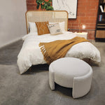 Add a contemporary touch to your seating arrangement with this lovely ottoman. Featuring a round frame supported by a stunning off-white boucle upholstery for extra softness and comfort. Use this 16x28” ottoman as a center table to display small tray and knick-knacks or as a place to prop your feet up after a long day.Depth : 25.5 in Amethyst Home provides interior design, new home construction design consulting, vintage area rugs, and lighting in the Salt Lake City metro area.