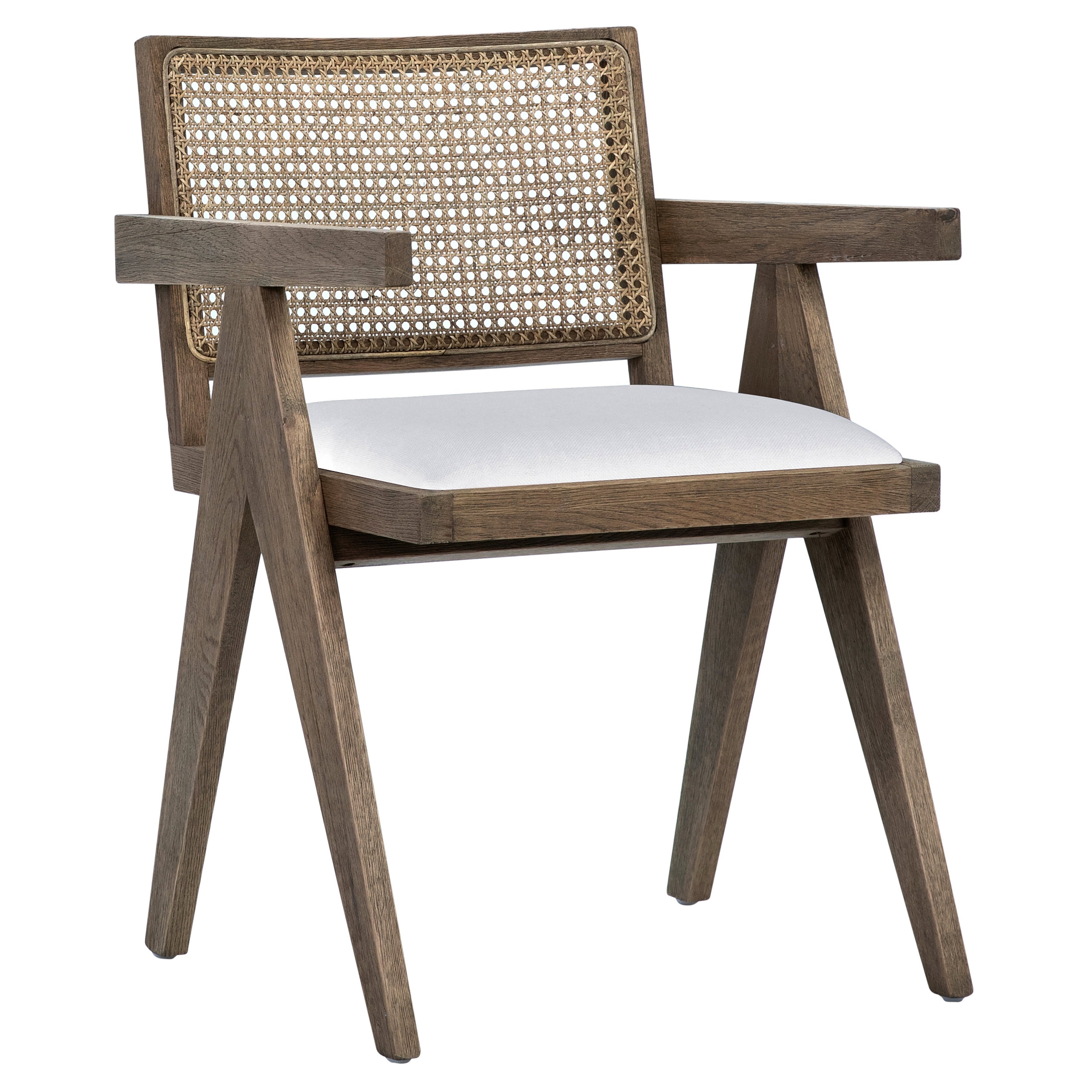 Finished in a grey wash with natural rattan, this beautiful Ocampo dining chair is modern with a tropical flare. The dining chair features a performance linen seat. Amethyst Home provides interior design, new construction, custom furniture, and area rugs in the Kansas City metro area.