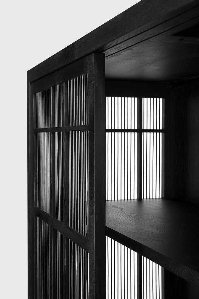 Like a shroud, the large sliding doors with bamboo spokes let light shimmer through. This creates an inequivalent sense of mystery and intrigue. The Burung storage cupboard in solid oak and bamboo, by Carlos Baladia, is designed with the personal objects you want to have close in mind. Amethyst Home provides interior design, new home construction design consulting, vintage area rugs, and lighting in the Boston metro area.