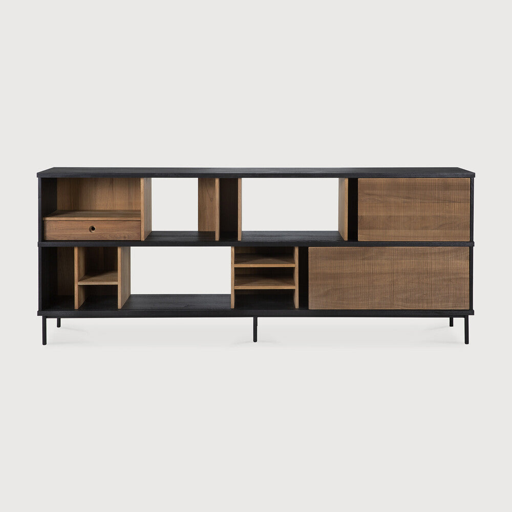 The Oscar sideboard in solid teak by Alain van Havre is the perfect multi-tasker: its open spaces can be used to exhibit personal objects, whereas the sliding doors offer the option of organizing documents out of sight. Notice the exceptional grooves in the doors: each narrow groove was carefully hand carved, making every Oscar piece unique. Amethyst Home provides interior design, new home construction design consulting, vintage area rugs, and lighting in the Calabasas metro area.