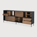 The Oscar sideboard in solid teak by Alain van Havre is the perfect multi-tasker: its open spaces can be used to exhibit personal objects, whereas the sliding doors offer the option of organizing documents out of sight. Notice the exceptional grooves in the doors: each narrow groove was carefully hand carved, making every Oscar piece unique. Amethyst Home provides interior design, new home construction design consulting, vintage area rugs, and lighting in the San Diego metro area.