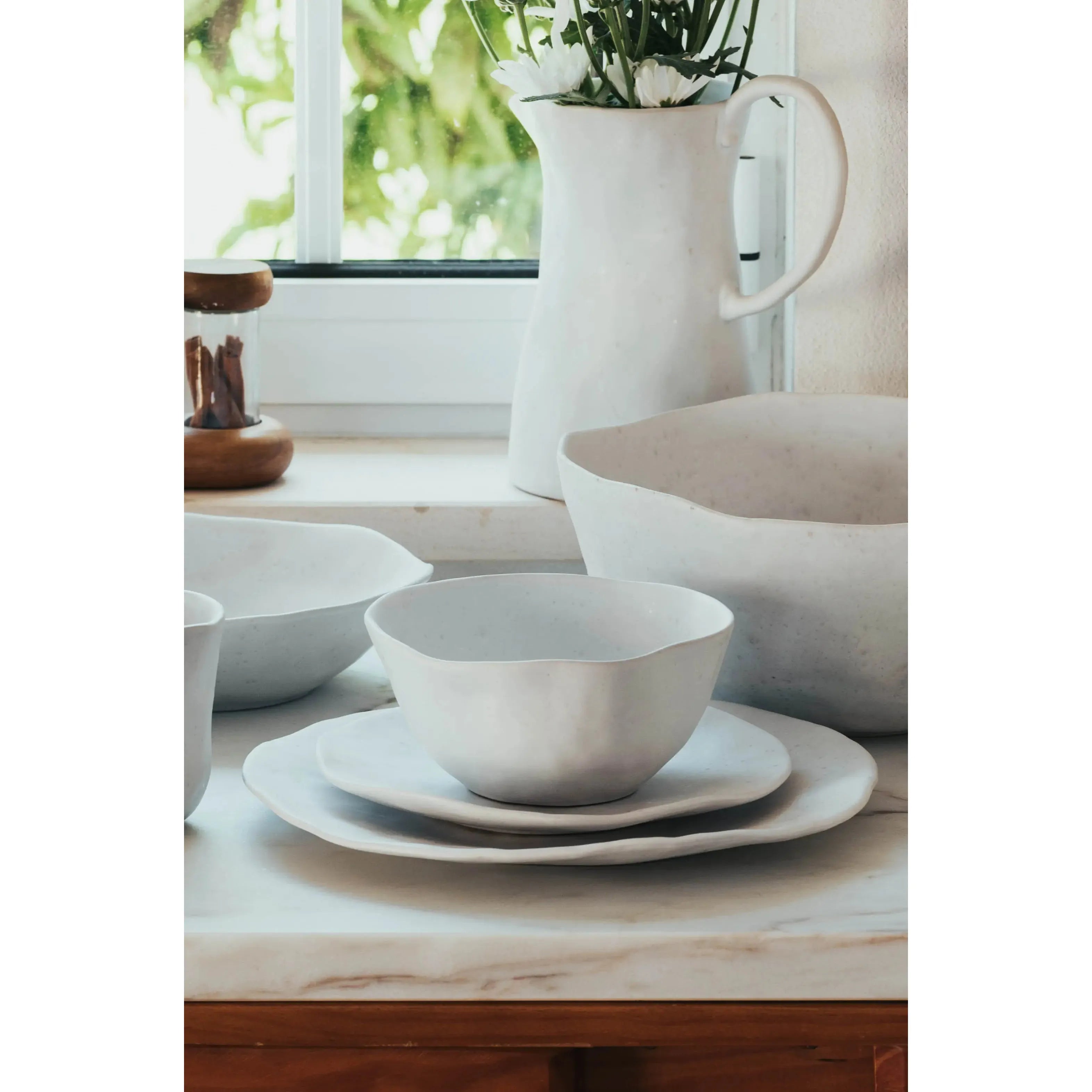 This matte glaze bowl is a beautiful dinner table item! With an elegant white color, is also perfect for use as decorative piece. And for a very special set, check out all of our unique "Nature Shape Smooth White" products. Amethyst Home provides interior design services, furniture, rugs, and lighting in the Kansas City metro area.