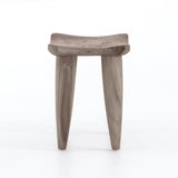 Inspired by West African design, the Zuri Weathered Grey Teak Outdoor Stool features organic knots, holes and graining to reflect its materials' rich roots, indoors or out. Cover or store inside during inclement weather and when not in use.  Size: 20"w x 13"d x 17"h Materials: Solid Teak