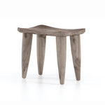 Inspired by West African design, the Zuri Weathered Grey Teak Outdoor Stool features organic knots, holes and graining to reflect its materials' rich roots, indoors or out. Cover or store inside during inclement weather and when not in use.  Size: 20"w x 13"d x 17"h Materials: Solid Teak