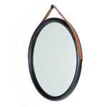 The Des Mirror is hung by a handsome, toffee-colored top grain leather strap. We love the fresh take on what would otherwise be a traditional, round mirror. The mirror is framed in black-washed popular and would like amazing hung in an entryway, bedroom, or other space.   Overall Dimensions: 30.00"w x 1.50"d x 30.00"h Colors: Natural Iron, Black Wash Poplar, Toffee Leather Materials: Iron, Solid Poplar, Top Grain Leather  Please allow 3-4 weeks on shipment for these items. 