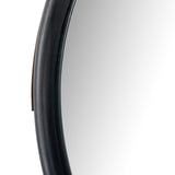 The Des Mirror is hung by a handsome, toffee-colored top grain leather strap. We love the fresh take on what would otherwise be a traditional, round mirror. The mirror is framed in black-washed popular and would like amazing hung in an entryway, bedroom, or other space.   Overall Dimensions: 30.00"w x 1.50"d x 30.00"h Colors: Natural Iron, Black Wash Poplar, Toffee Leather Materials: Iron, Solid Poplar, Top Grain Leather  Please allow 3-4 weeks on shipment for these items. 