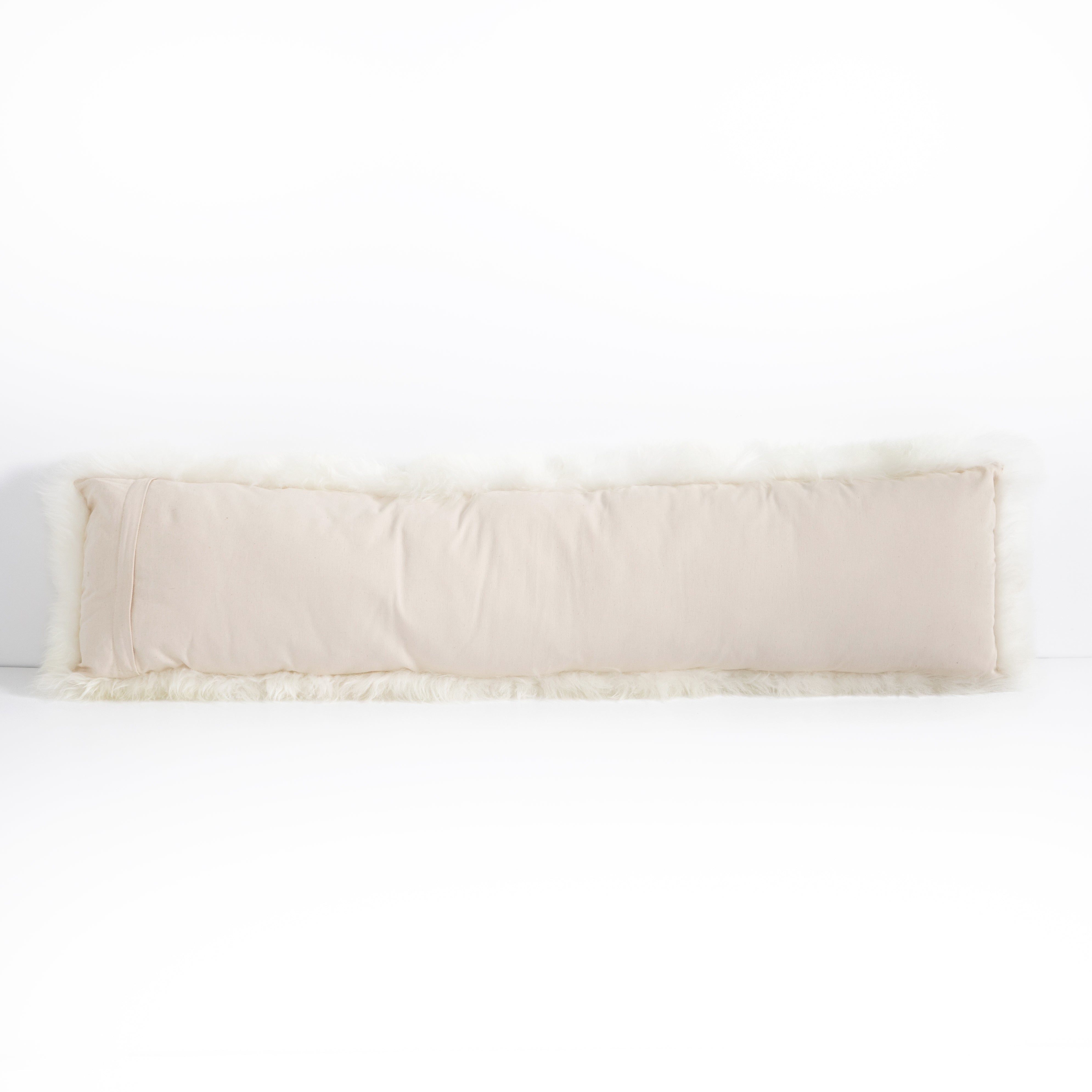This Lalo Lambskin Lumbar Pillow is made of 100% unshorn sheekskin and brings all the texture to your bedroom or living room sofa.   Overall Dimensions: 48.00"w x 0.50"d x 12.00"h Colors: White Lambskin Materials: 100%Unshornsheepskin
