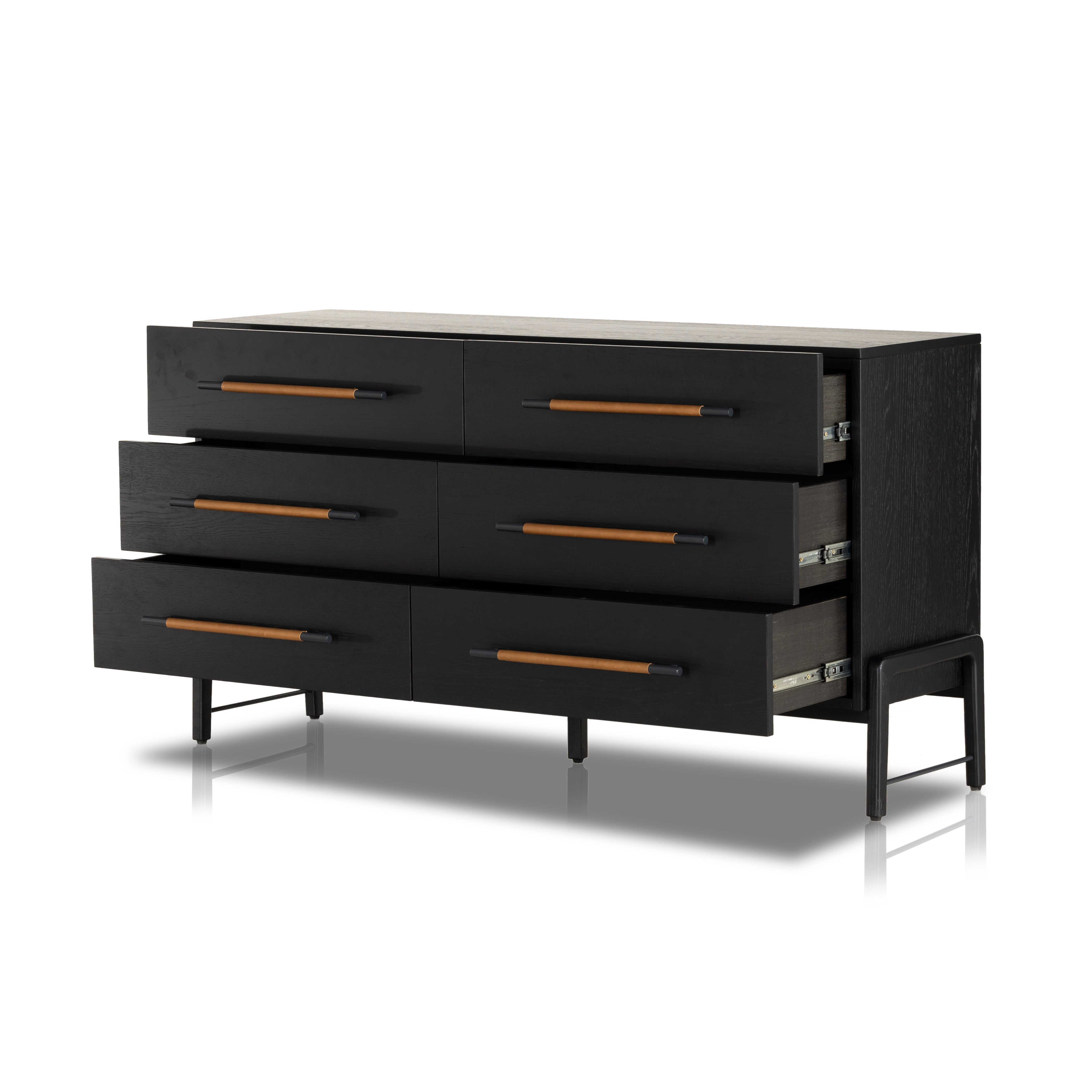 The ebony oak of this Rosedale 6 Drawer Dresser brings a moody, darkness to any room. With six spacious drawers and iron hardware wrapped in a gorgeous, tan leather, this is a functional and beautiful piece to add to your bedroom or other area.  Amethyst Home provides interior design, new home construction design consulting, vintage area rugs, and lighting in the Miami metro area.