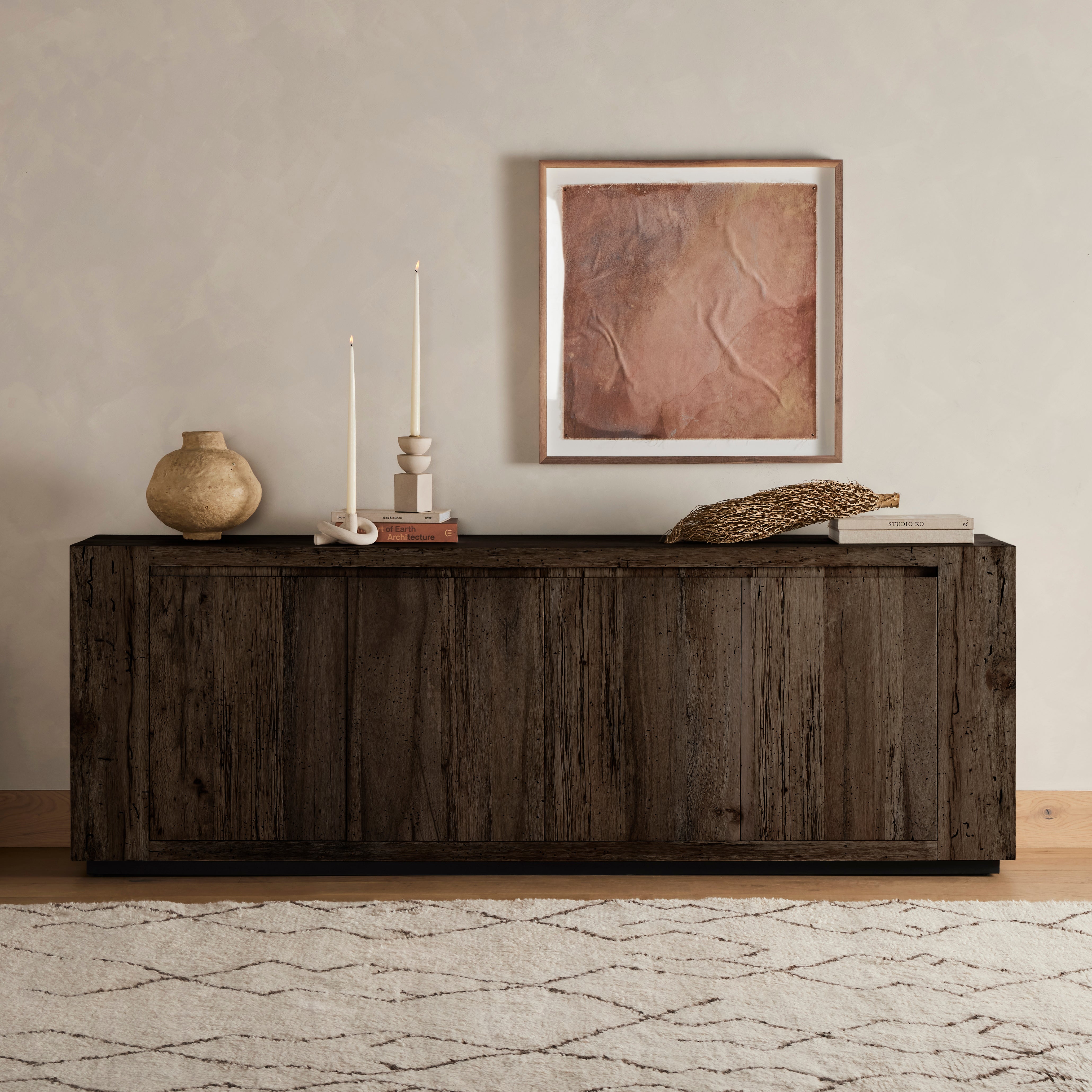 Made from thick-cut oak veneer with a faux rustic finish made to emulate wormwood, this low, large-scale sideboard features chunky squared legs and dovetail joinery detailing. Amethyst Home provides interior design, new home construction design consulting, vintage area rugs, and lighting in the Boston metro area.