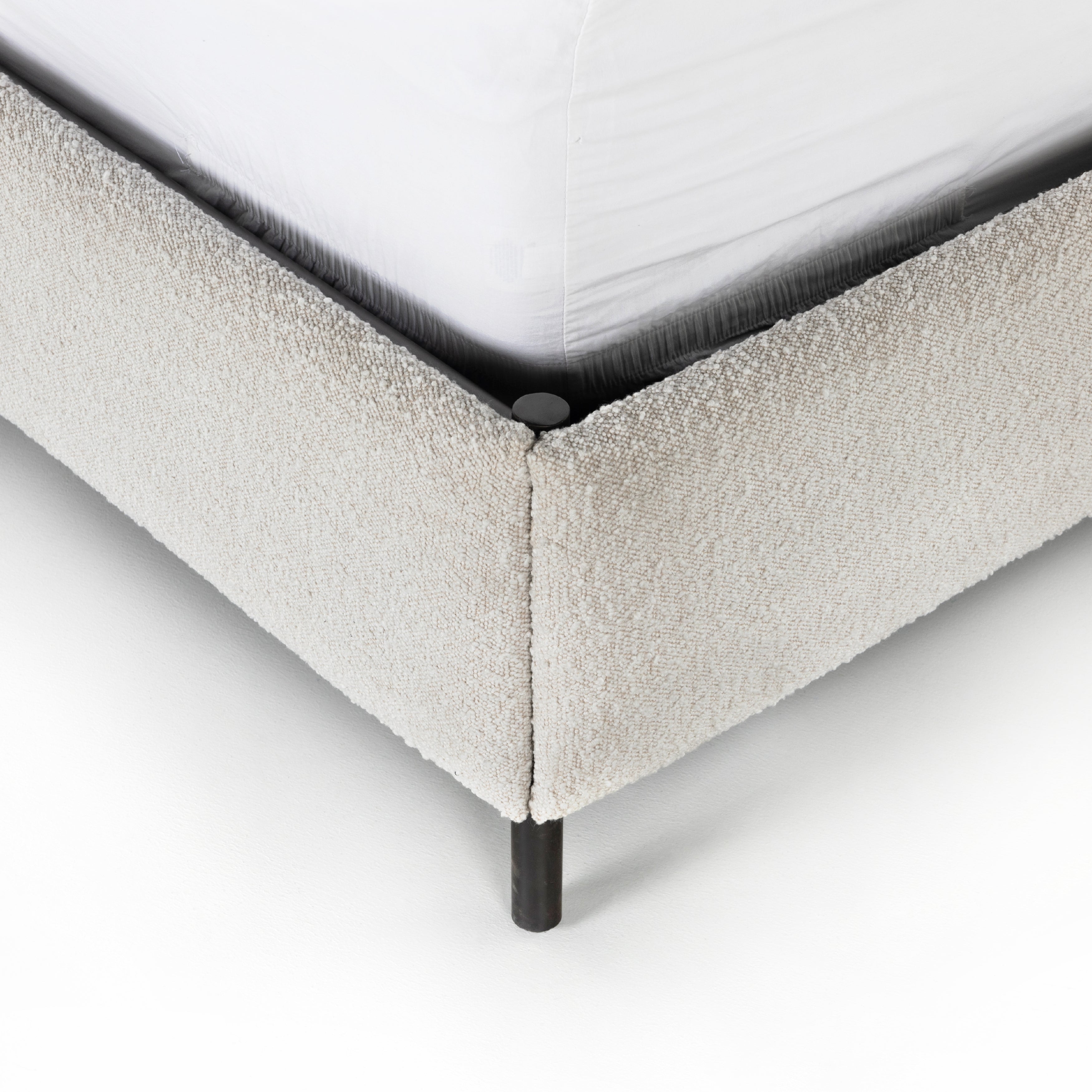 Bring texture into play. Upholstered in a classic cream-colored boucle, with decorative leather straps adding a material-driven touch with contrast. Standard box spring required. Amethyst Home provides interior design services, furniture, rugs, and lighting in the Monterey metro area.