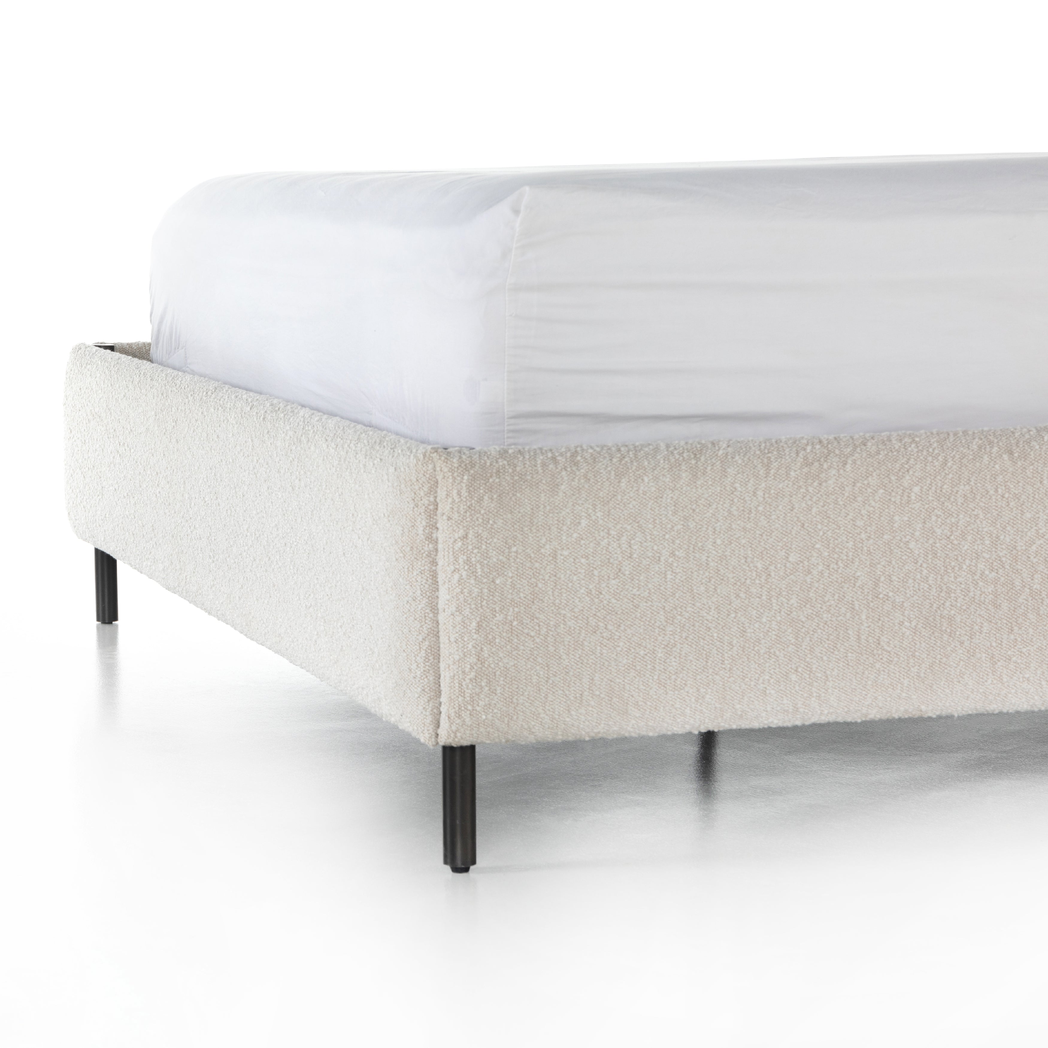 Bring texture into play. Upholstered in a classic cream-colored boucle, with decorative leather straps adding a material-driven touch with contrast. Standard box spring required. Amethyst Home provides interior design services, furniture, rugs, and lighting in the Portland metro area.